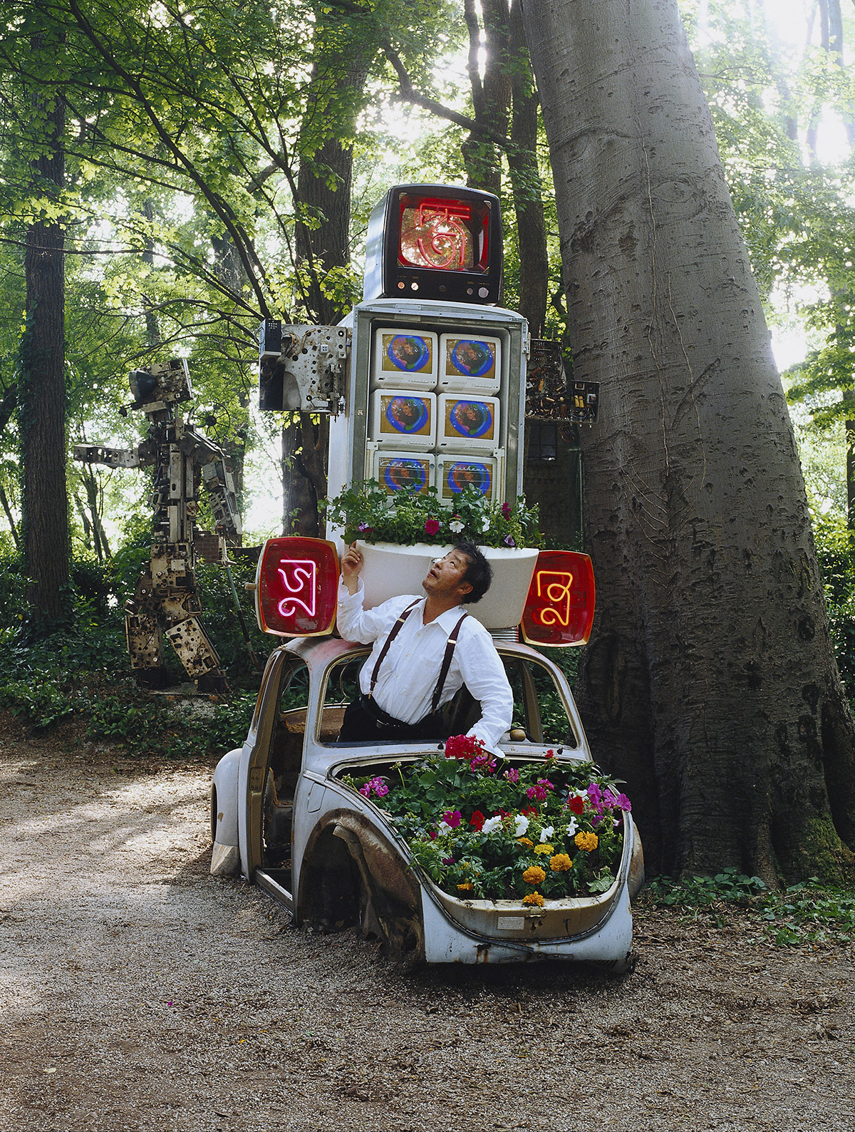 Nam June Paik with Marco Polo, Cover Image for the 1993 German
                  Pavilion at Venice Biennale Catalogue ⓒ (photo) Roman Mensing,
                  artdoc.de