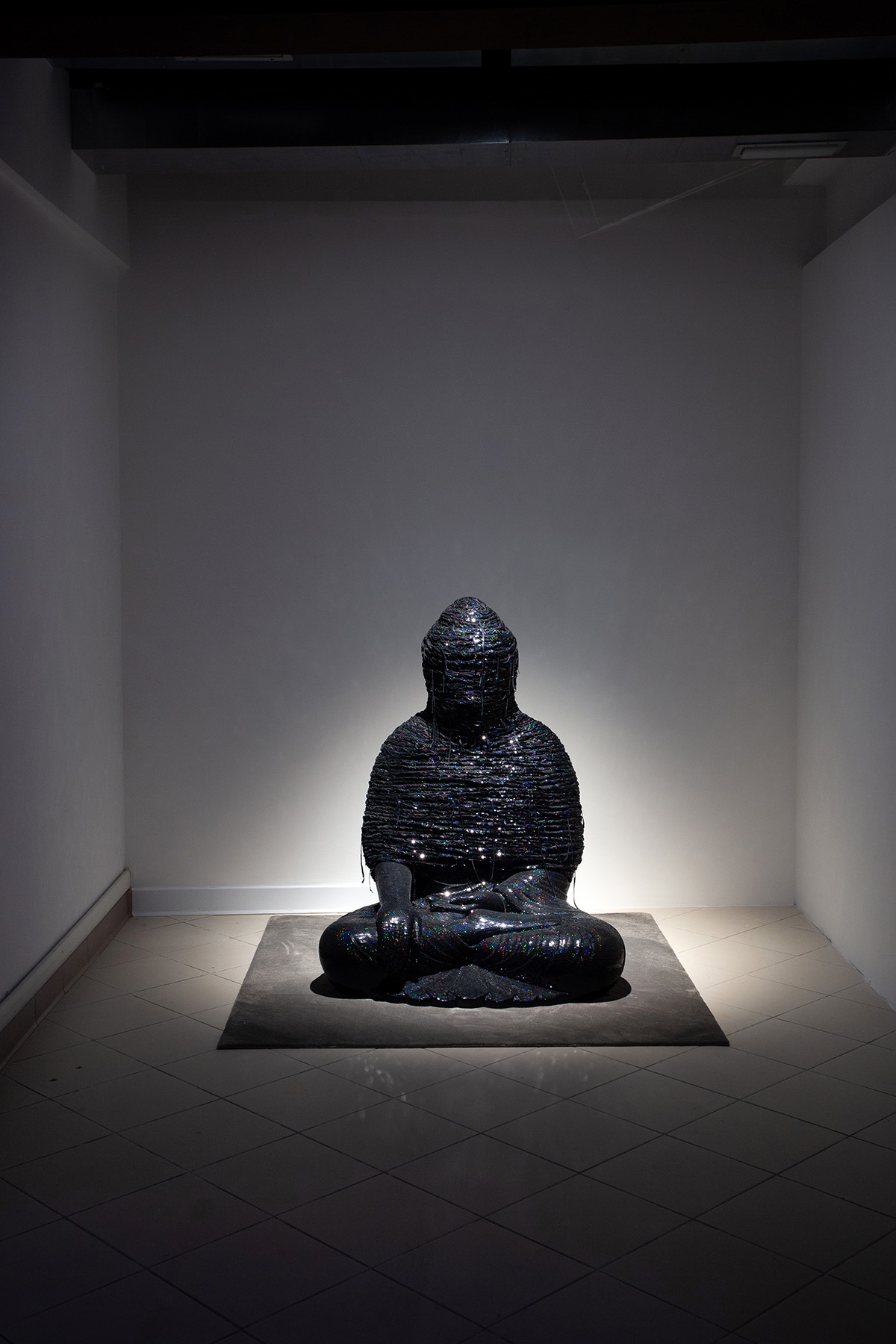 Noh Sang-Kyoon, For the Worshipers, 2014-2016, sequins
                  on the Buddha statue of polyester resin and fiberglas, 118 ×
                  93.5 × 76.5 cm. Provided by Bf. photograph by Hyunjung Kwon.